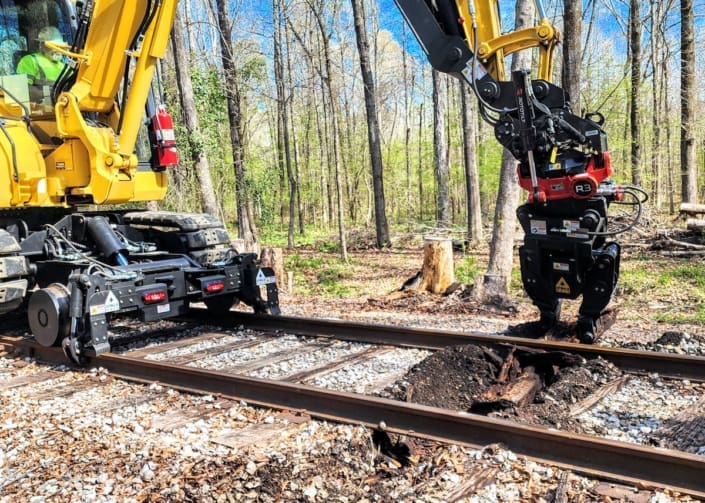 SDAC Rail Tie Changeout with DymaxRail on Komatsu PC88 SDAC Rail crew using DymaxRail Tie Inserter on Komatsu PC88 with hi-rail system during 500-tie changeout on Heart of Dixie Railroad