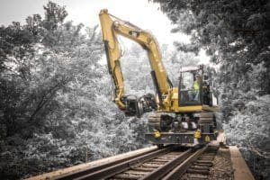 Front view of MPX Hydrostatic Rail Cart using limb shear attachment on railroad