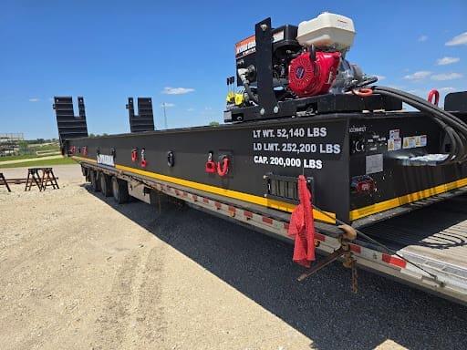 DymaxRail Machinery Cart secured on a trailer during transport to the jobsite.