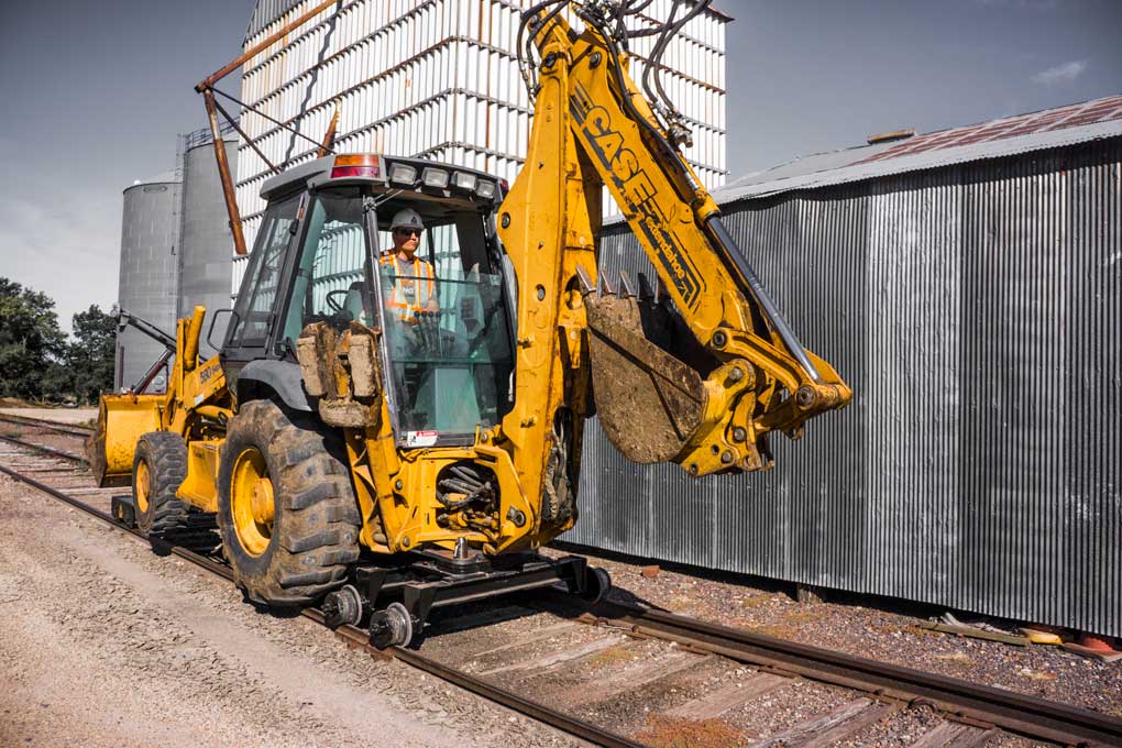 Case 580 590 Rail Rider backhoe loader model Case 580 or 590 backhoe loader configured for the Dymax Rail Rider hi-rail guide system