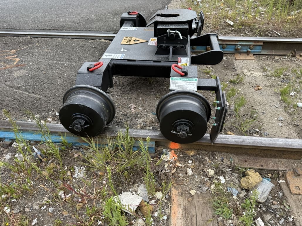 Close-up of LoPro hi-rail dolly positioned on railroad track