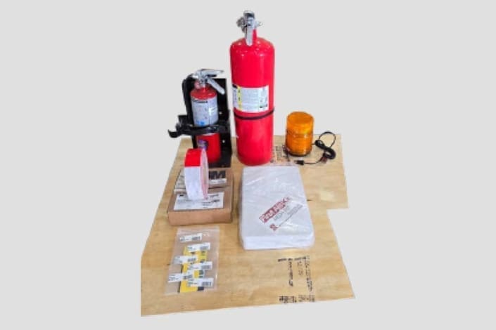 Dymax Rail Rider X2-15T FRA installation kit including beacon, fire extinguisher, retroreflective tape, decals, and first aid kit for U.S. and Canada rail markets