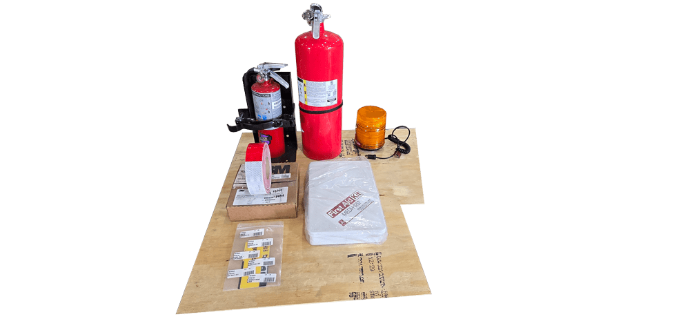 FRA safety equipment included with the Dymax Rail Rider X2 hi-rail system, including fire extinguishers, first aid kit, amber strobe light, and retroreflective tape