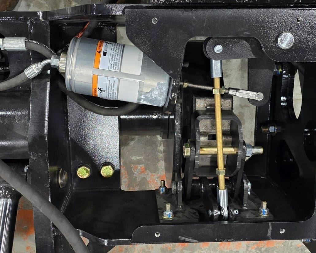 Close-up of the Dymax Rail Rider X2 spring-applied hydraulic release (SAHR) braking system on the hi-rail undercarriage
