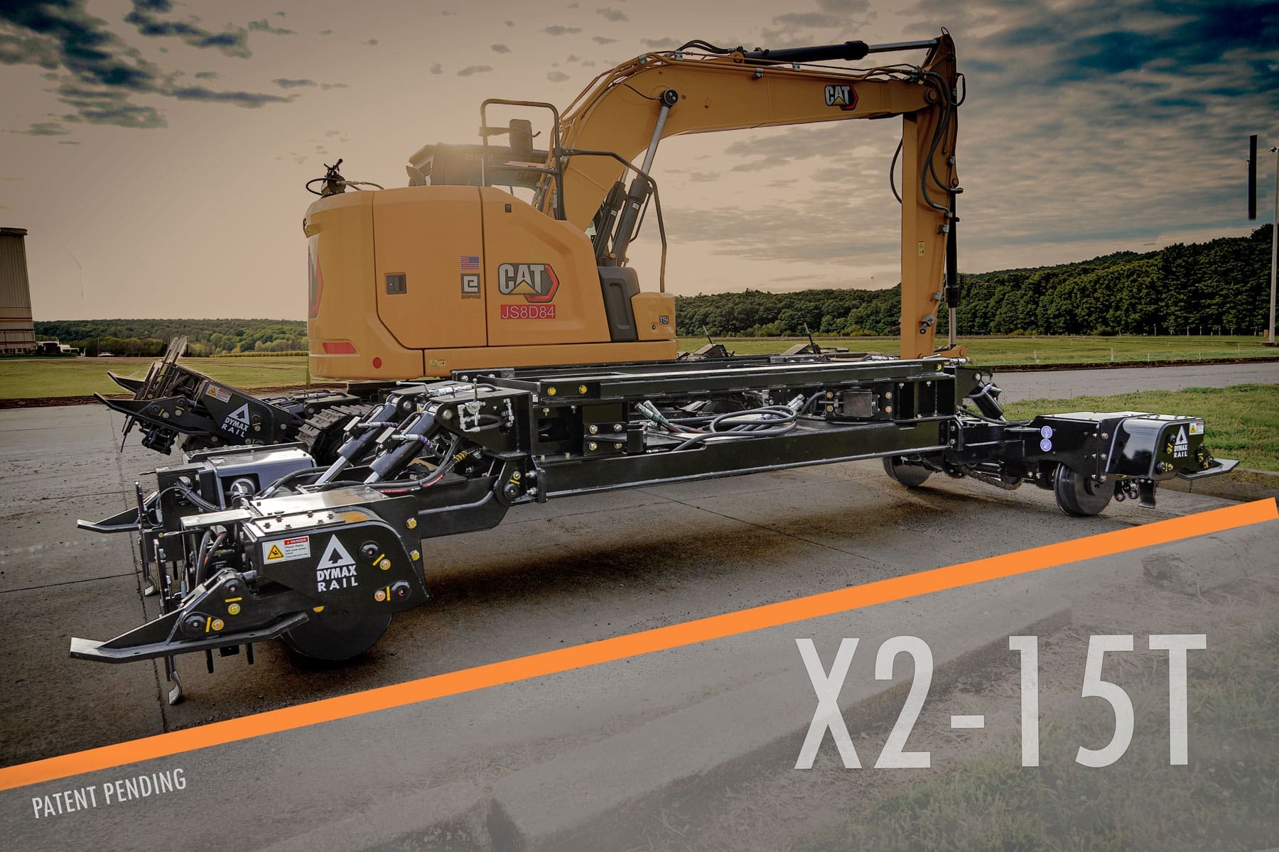 Dymax Rail Rider X2-15T detachable heavy-duty hi-rail frame installed on a track excavator without cutting, welding, or permanent machine modifications