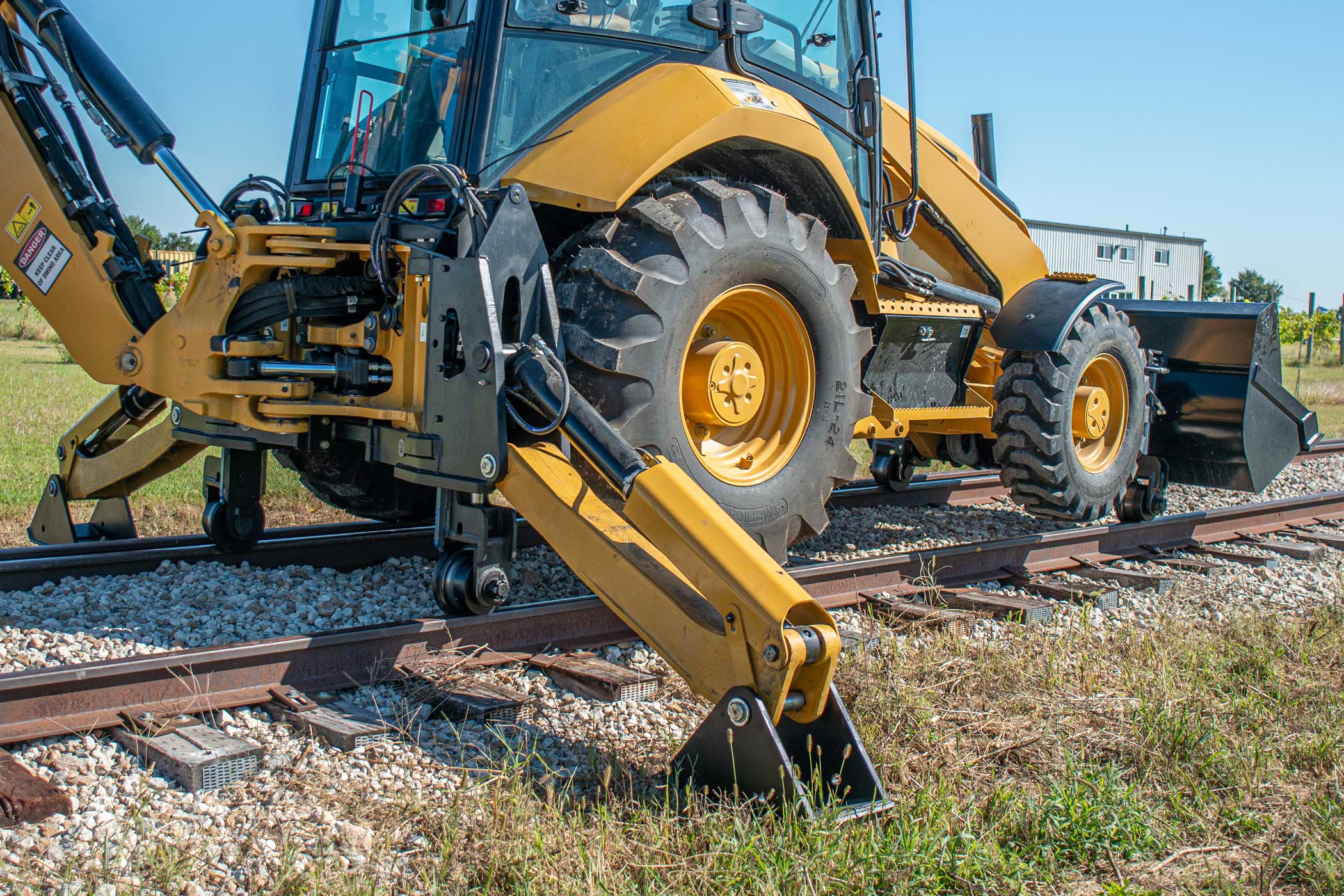 Dymax Rail Rider X2-15T detachable hi-rail attachment for 13-15-ton track excavators — Cat 313/315, Deere 135/145, Komatsu PC138 class