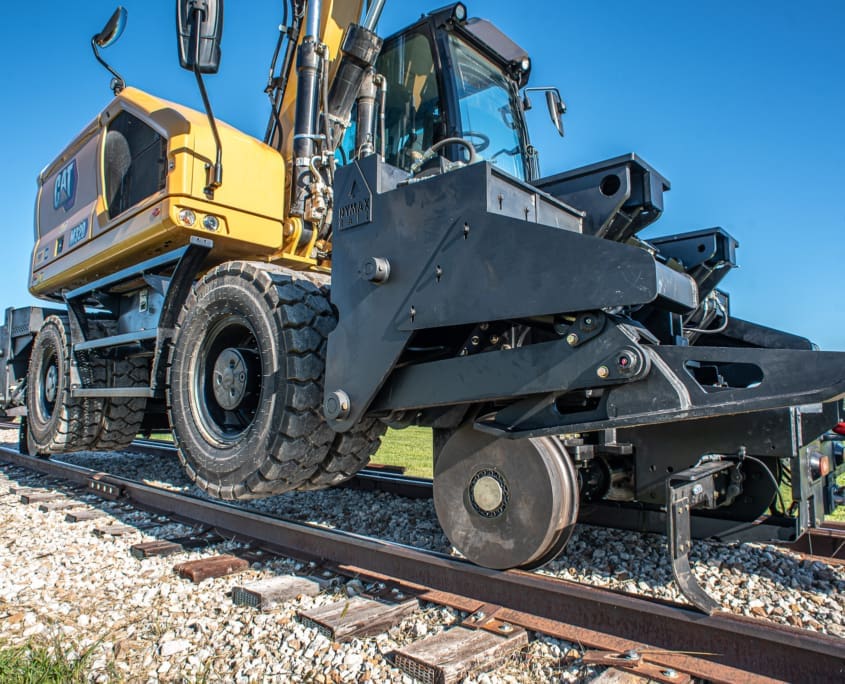 Hydrostatic Drive — wheel excavator on rails DymaxRail Rail Rider WX with hydrostatic drive providing powered rail travel for wheel excavators